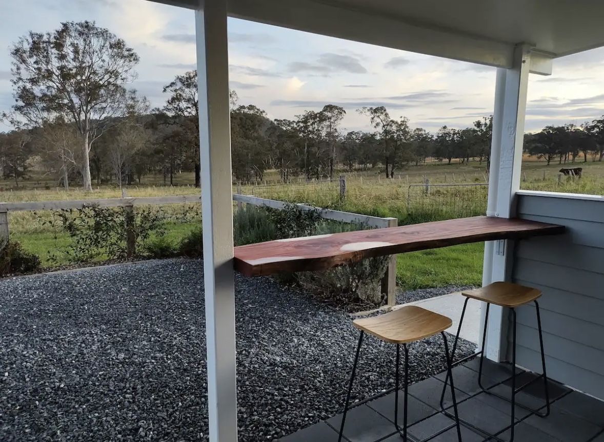 View from the cottage deck over paddocks towards the hills near Nabiac